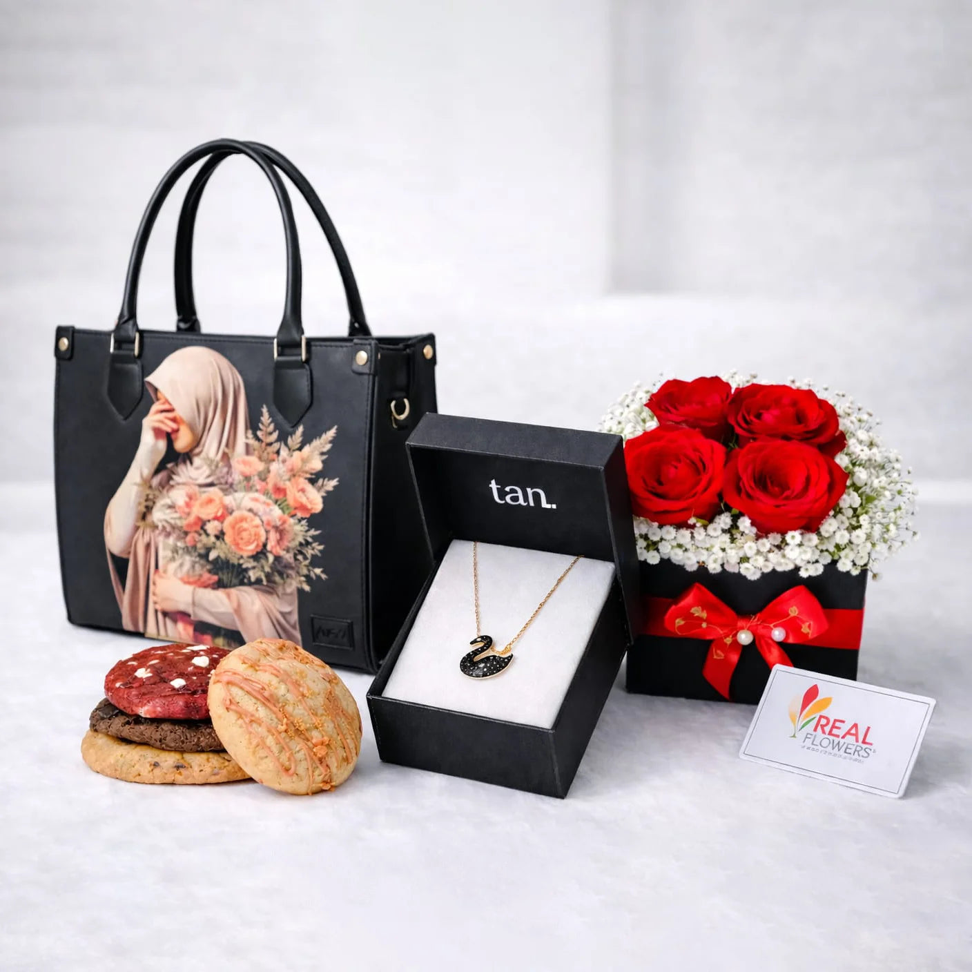 Black Canvas tote bag, swan necklace, Assorted cookies & floral box gift combination set with same day delivery in Pakistan - Real Flowers PK