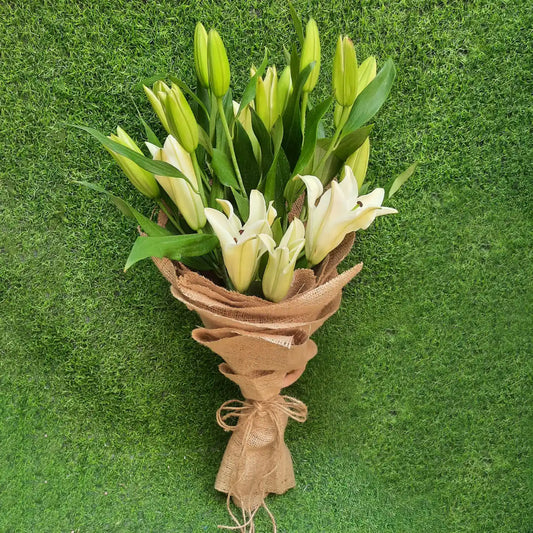 A Hand-Tied Bouquet of fresh Lily flowers wrapped in jute- Real Flowers Pakistan