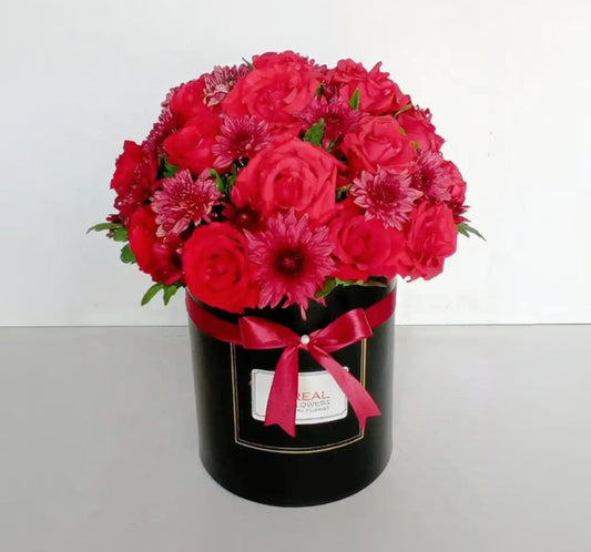 Fresh Red Roses Chrysanthemums in a round gift box with bow ribbon - Real Flowers.pk
