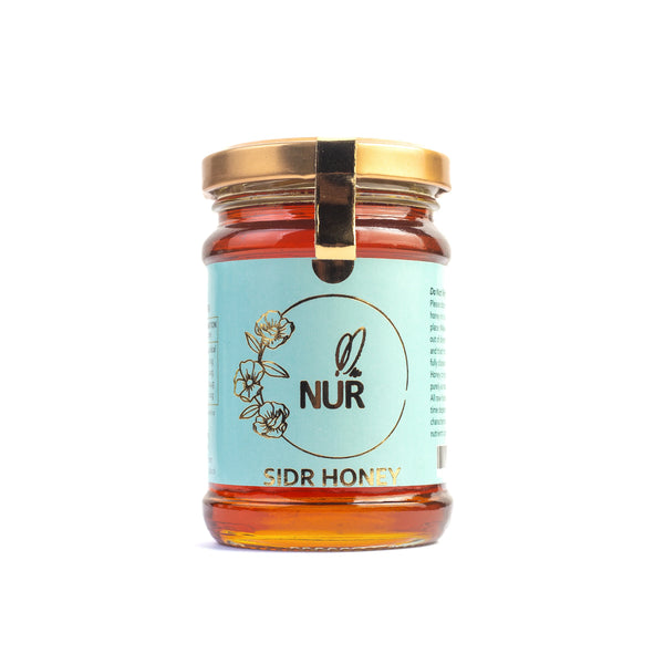 Nur Sidr honey in a jar with raw, unprocessed honey from Pakistan