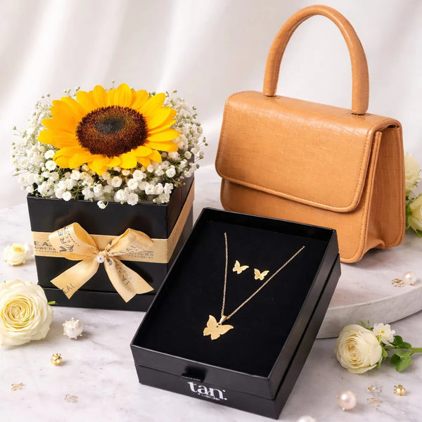 A Gift Combination set of tan. handbag, a sunflower box arrangement and butterfly necklace set - Real flowers Pakistan